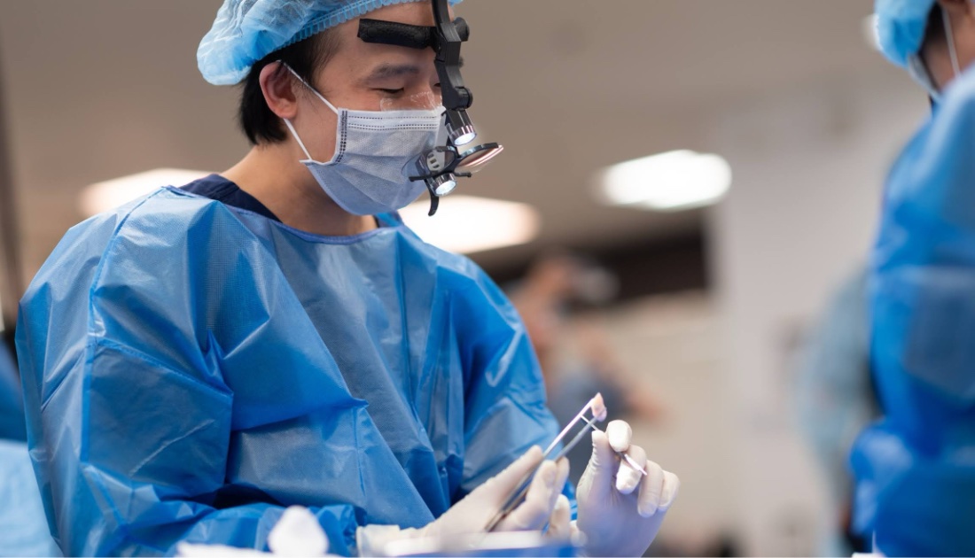 Dr. Joe performing surgery in the operating room